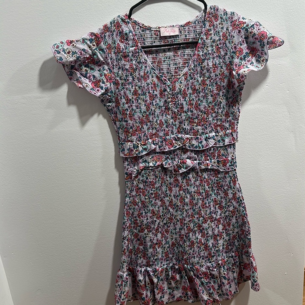 Purple floral. Stretchy and ruffles.